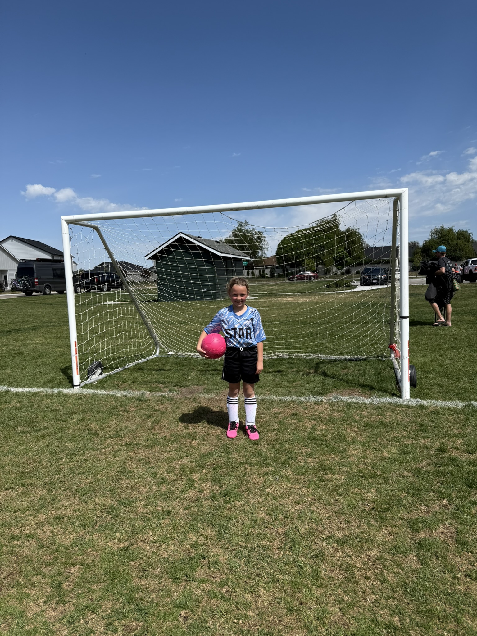 Grace standing in front of a soccer goal