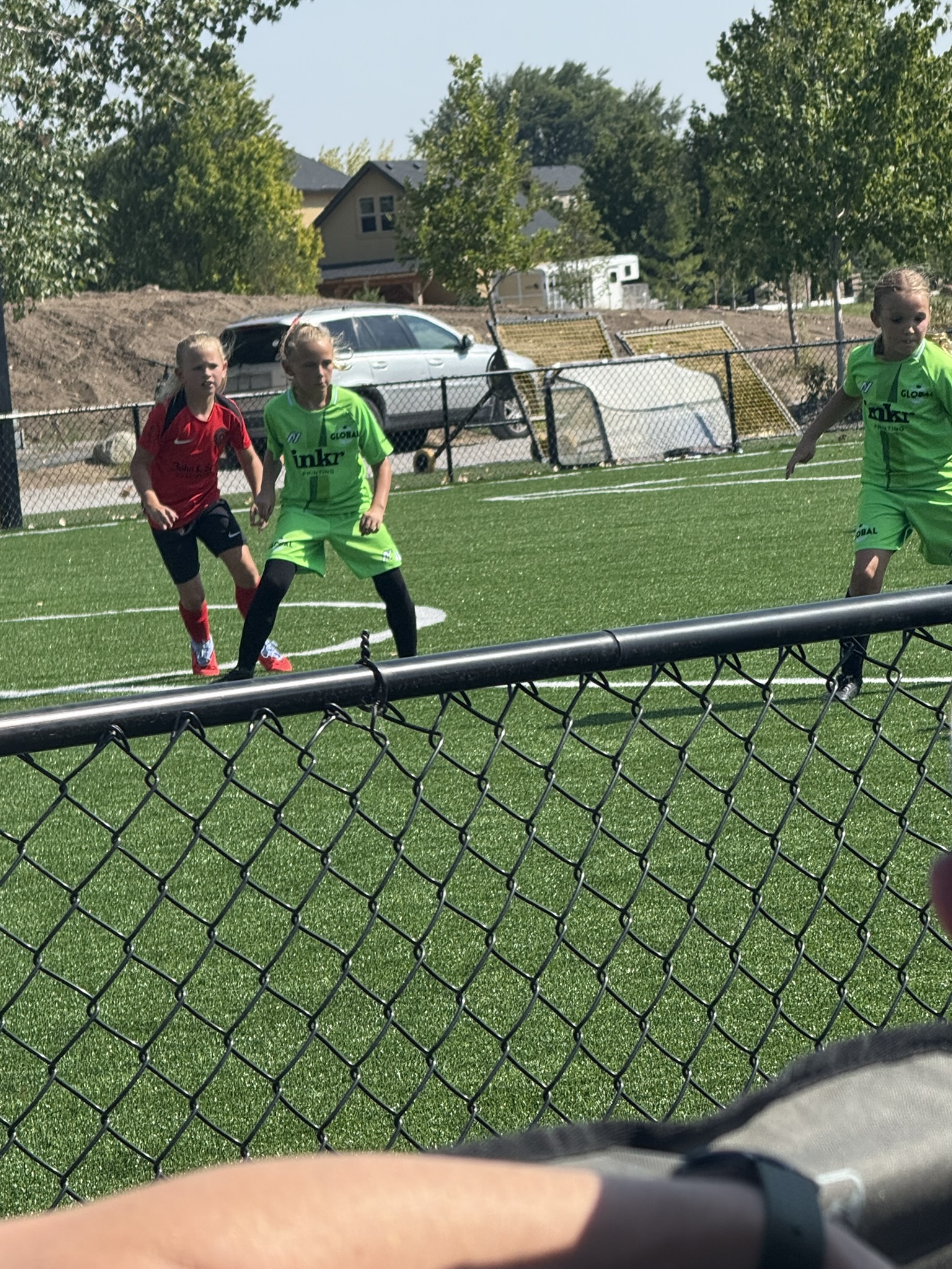 Grace playing on an outdoor turf field